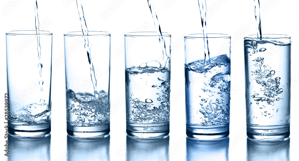 pouring water in a glass collection isolated